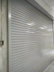 Grey Powder Coated Motorised Aluminium Roller Shutters Installation at Woodlands Link Completed