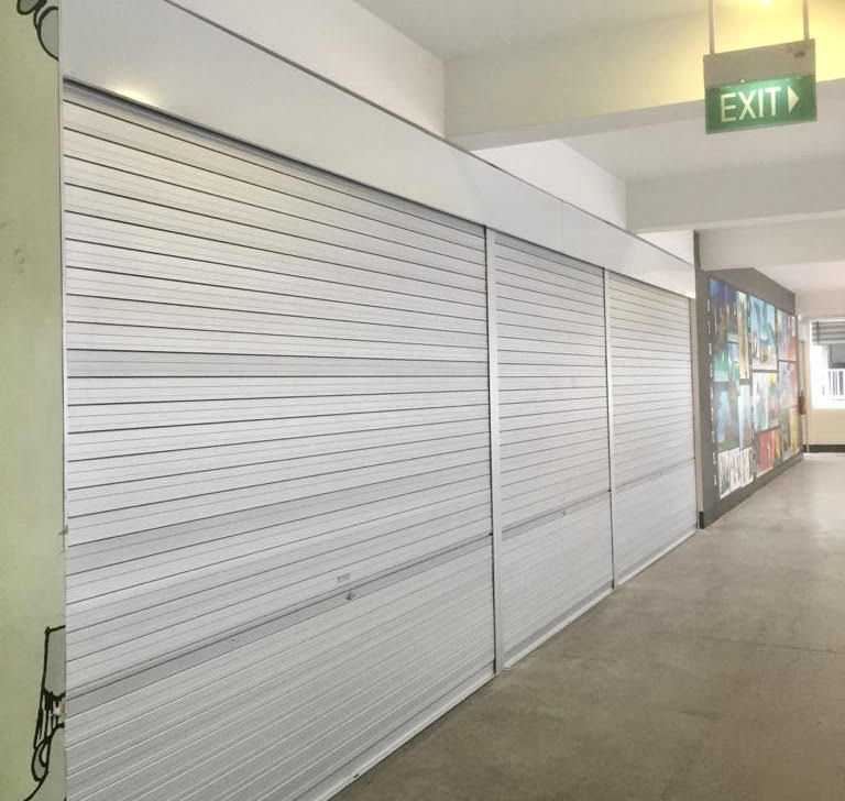 3 Panels of Manually Operated Aluminium Roller Shutters Installed at Multi Purpose Hall Entrance for Primary School